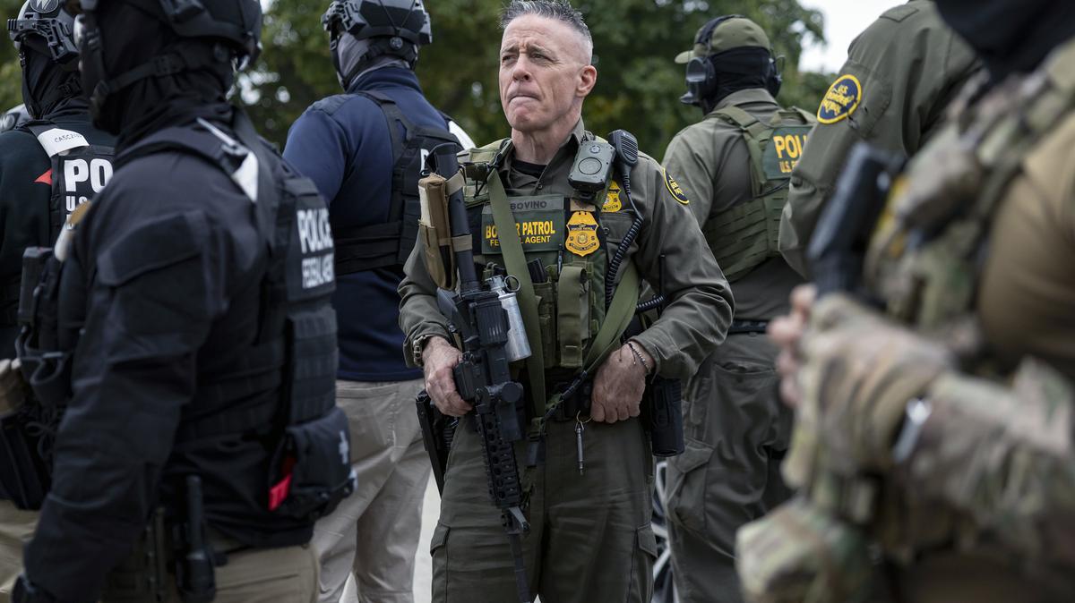 Then-Border Patrol Cmdr. Gregory Bovino watches as agents detain a man they found painting a house in Chicago’s Edison Park neighborhood, Oct. 31, 2025. (Brian Cassella/Chicago Tribune/TNS)