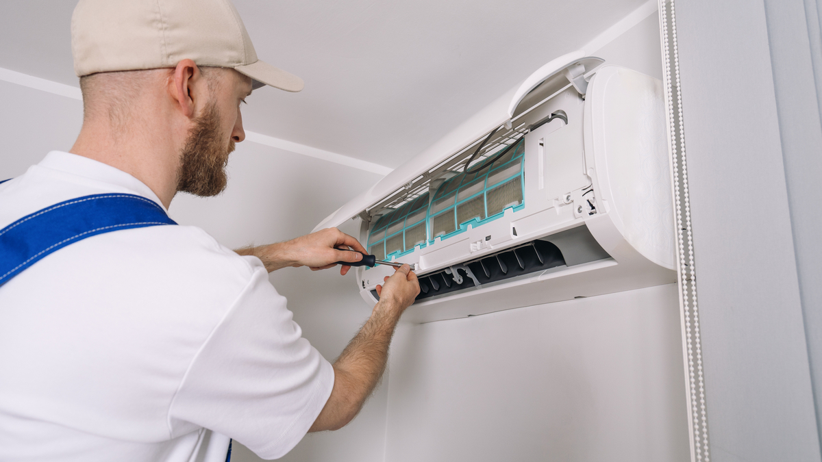 Simple seasonal maintenance, like replacing air filters and clearing debris around outdoor units, can help homeowners keep air conditioning systems running efficiently all summer long. (Dreamstime/TNS)