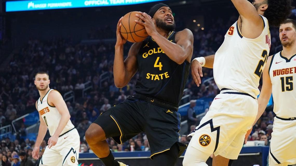 Short-handed Warriors use late surge to upend Nuggets 