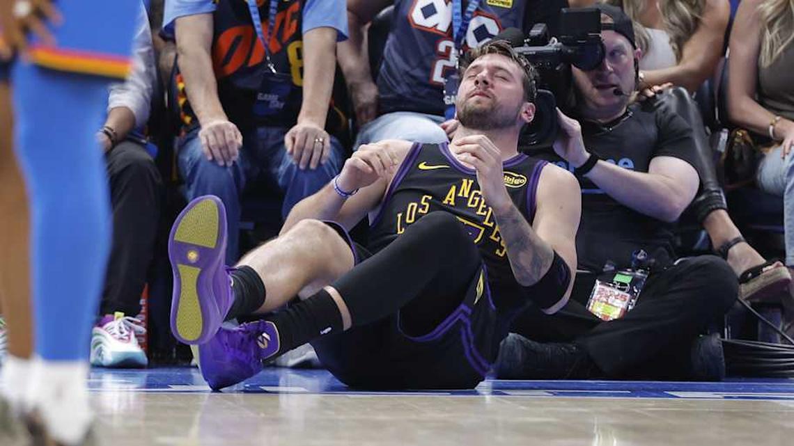  Apr 2, 2026; Oklahoma City, Oklahoma, USA; Los Angeles Lakers guard Luka Doncic (77) falls to the court during a play against the Oklahoma City Thunder during the third quarter at Paycom Center. Mandatory Credit: Alonzo Adams-Imagn Images | Alonzo Adams-Imagn Images 