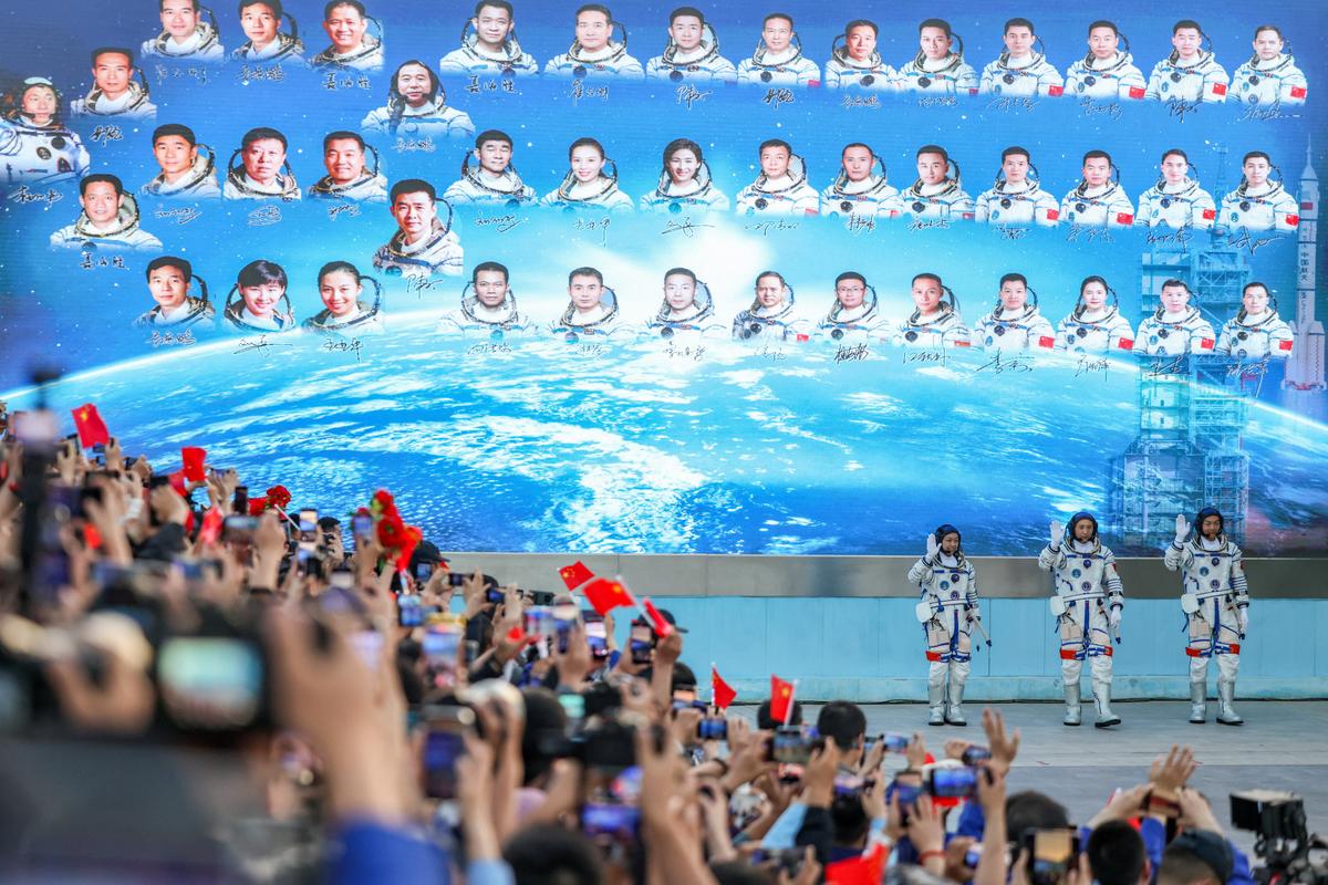 Astronauts Zhu Yangzhu, Zhang Zhiyuan, and Lai Ka-ying, who is the first astronaut from Hong Kong, wave during a see-off ceremony before taking part in the Shenzhou-23 spaceflight mission to China's Tiangong space station, at Jiuquan Satellite Launch Center, near Jiuquan, Gansu province, China, May 24, 2026. REUTERS/Maxim Shemetov
