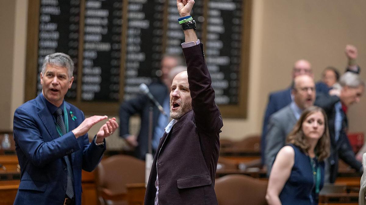 Rep. Alex Falconer and other Democrats yell "Hold the vote!" to Republican House Speaker Lisa Demuth at the Capitol on Thursday, May 14, 2026, demanding a vote on gun control measures. (Elizabeth Flores/The Minnesota Star Tribune/TNS)
