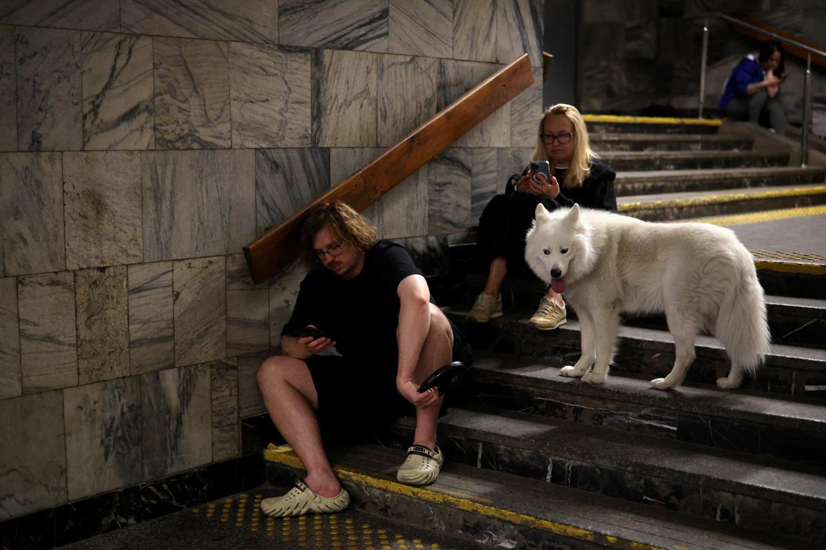 People shelter in a metro station during Russian missile and drone attacks, amid Russia's attack on Ukraine, in Kyiv, Ukraine May 24, 2026. REUTERS/Thomas Peter