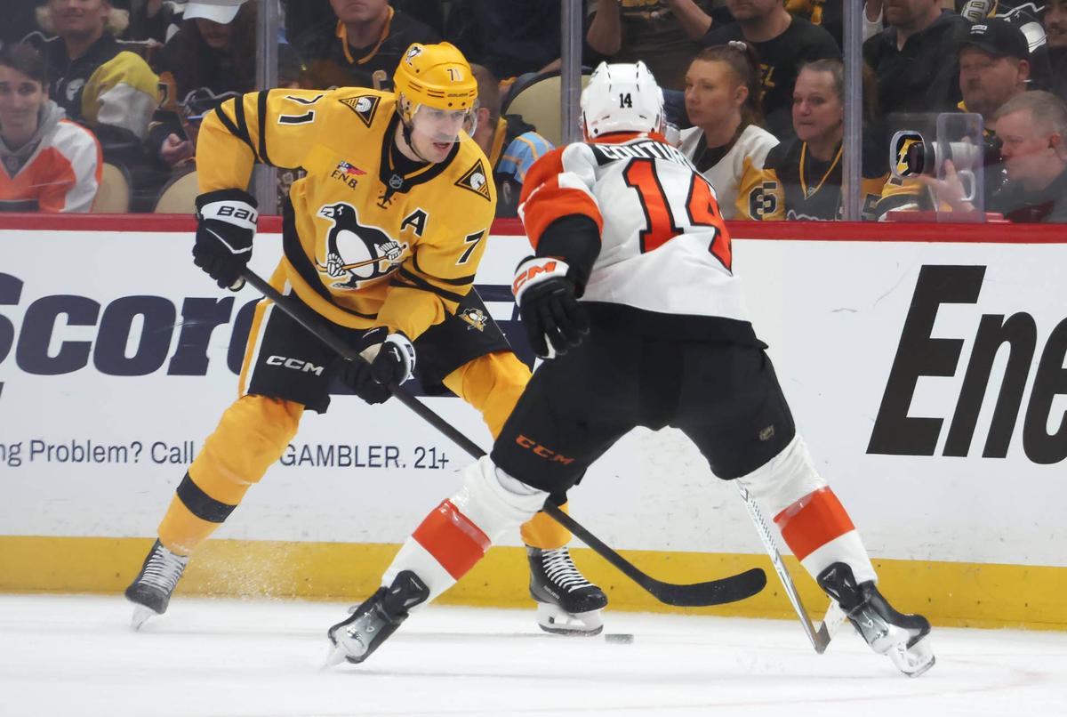  Pittsburgh Penguins center Evgeni Malkin (71) handles the puck against Philadelphia Flyers center Sean Couturier (14) during the second period in game two of the first round of the 2026 Stanley Cup Playoffs at PPG Paints Arena. Charles LeClaire-Imagn Images