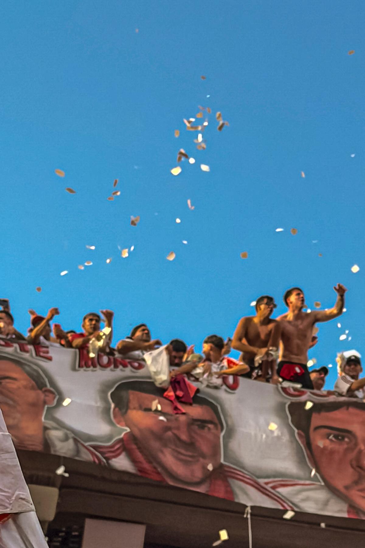 Soccer fans chant slogans during a game between River Plate and Boca Juniors at Estadio Monumental stadium in Buenos Aires, Argentina, on April 19, 2026. Dynamic ticket pricing has made this year's World Cup tournament the most expensive in history, pushing Argentine fans to extremes. (Sarah Pabst/The New York Times)