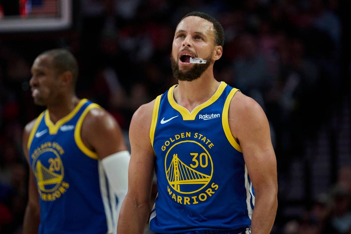  Oct 14, 2025; Portland, Oregon, USA; Golden State Warriors guard Stephen Curry (30) looks up a the scoreboard during the second half against the Portland Trail Blazers at Moda Center. Mandatory Credit: Troy Wayrynen-Imagn Images 