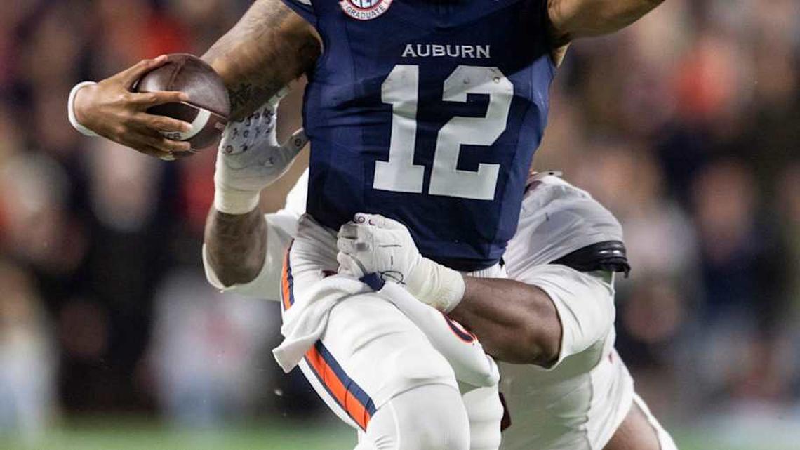  Auburn Tigers quarterback Ashton Daniels (12) runs the ball as Auburn Tigers take on Alabama Crimson Tide in the Iron Bowl at Jordan-Hare Stadium in Auburn, Ala. on Saturday, Nov. 29, 2025. Alabama Crimson Tide leads Auburn Tigers 17-6. | Jake Crandall/ Advertiser / USA TODAY NETWORK via Imagn Images 