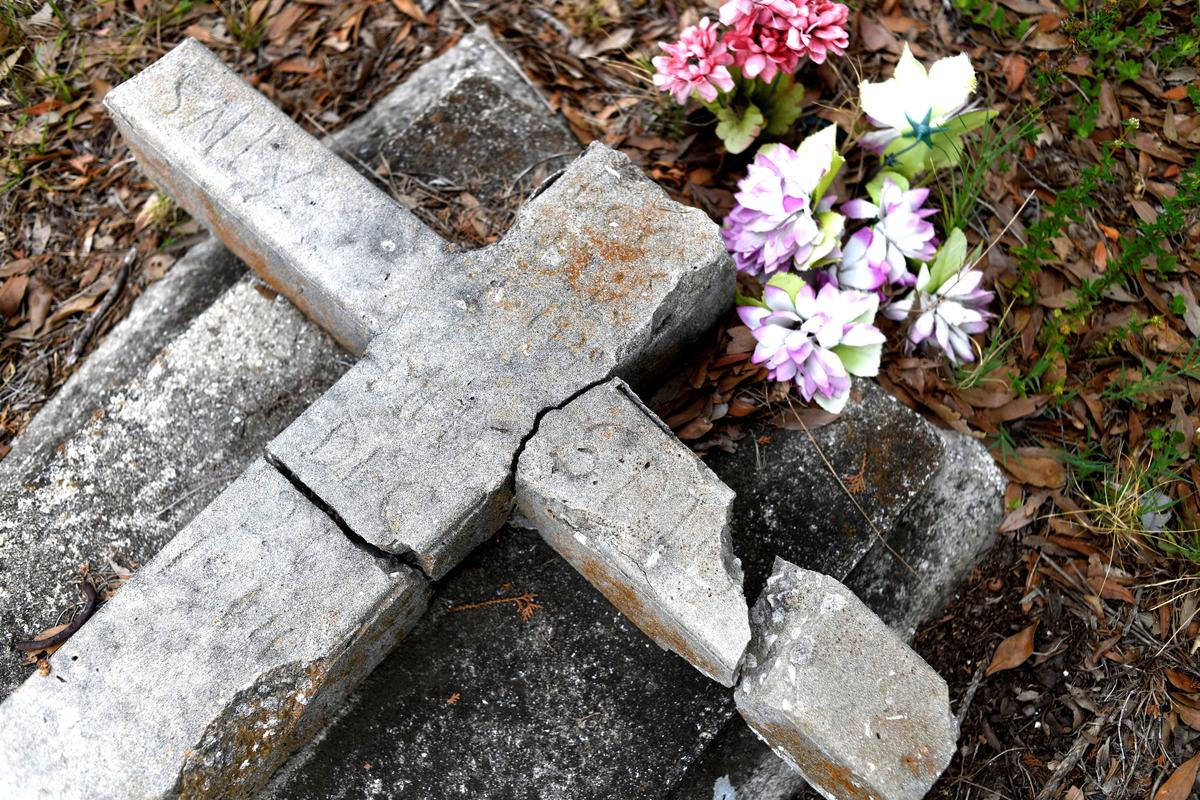 A grave at The Old Memphis Cemetery, a predominantly African-American cemetery, after the place was vandalized, with 17 gravesites and several headstones damaged in Palmetto, Florida, U.S., May 14, 2026. Authorities say “Trump” and “DeSantis” were spray-painted in red across several tombs as police continue investigating the incident. REUTERS/Octavio Jones