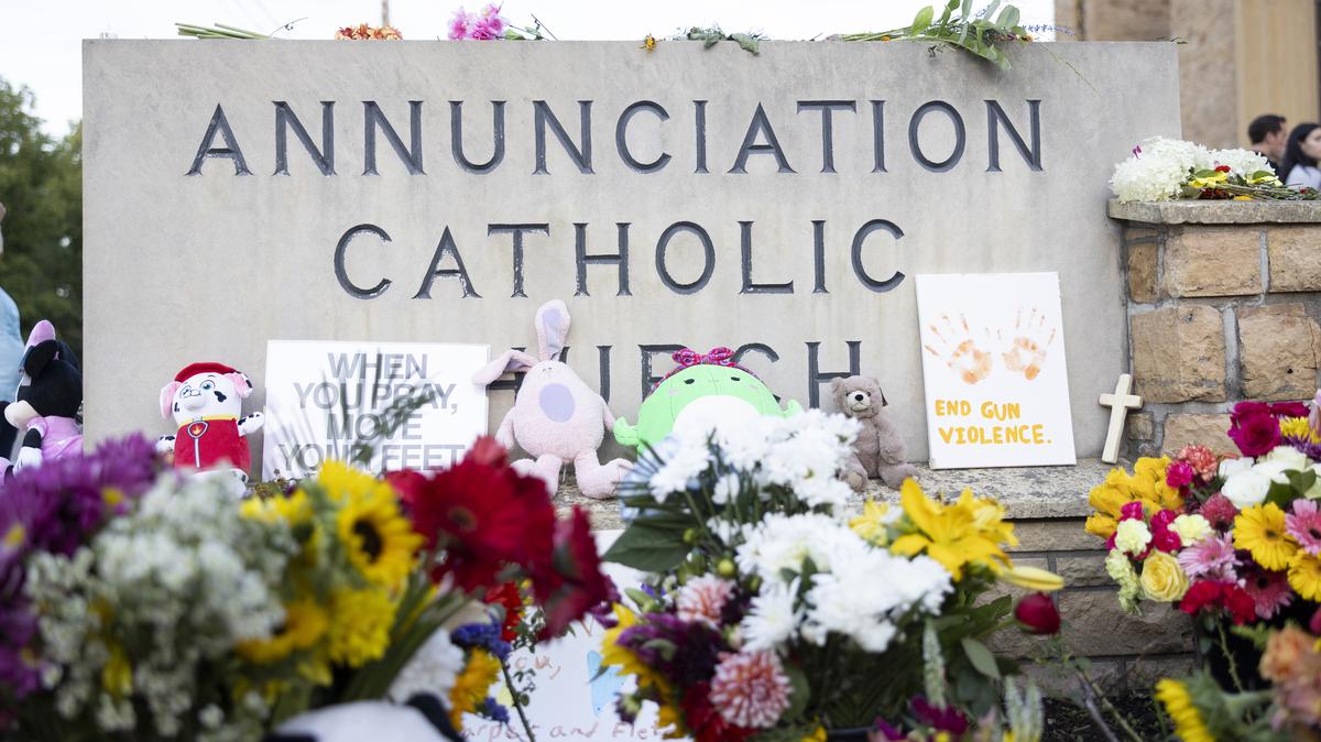 Flowers and other gifts are placed near Annunciation Catholic Church after Wednesday's school shooting, in Minneapolis, Minn., on Thursday, August 28, 2025. In the first Mass since an assailant attacked Annunciation Catholic Church, parishioners gathered to grieve and support one another.