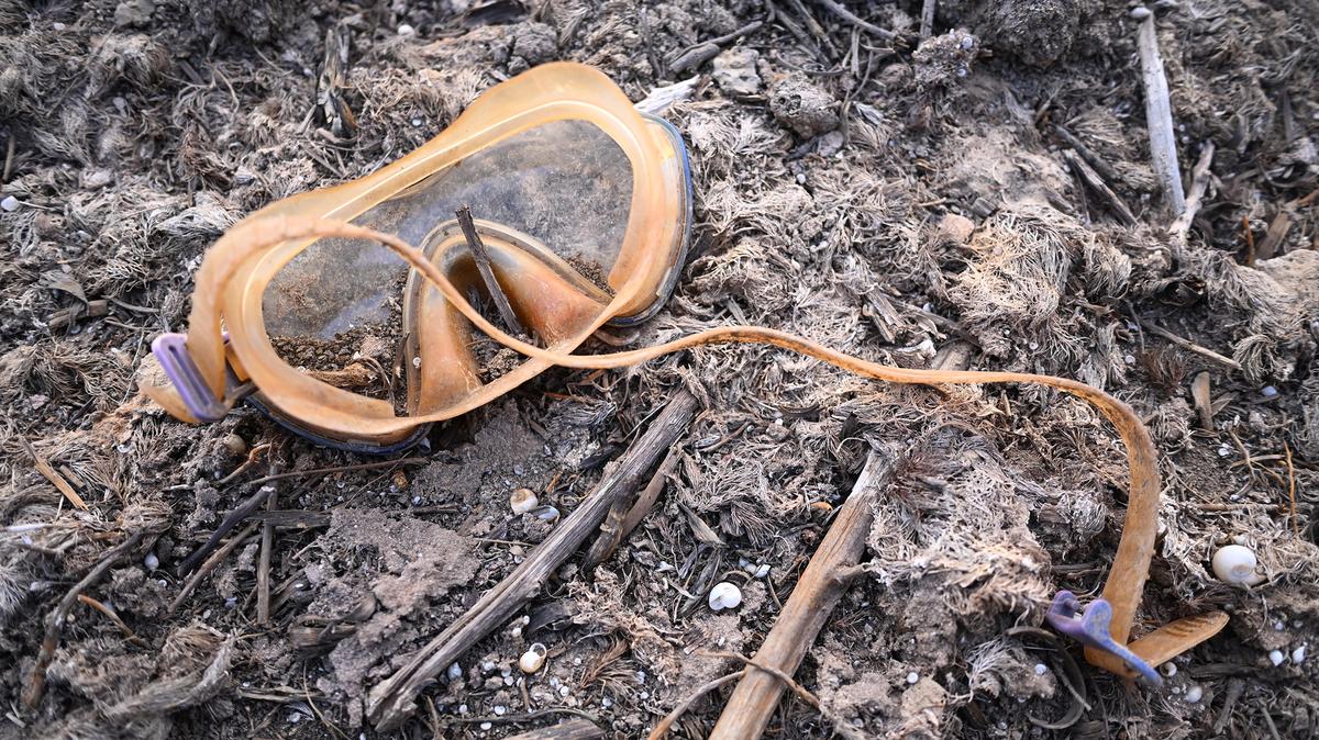 A child's swimming goggles lie on the dry bed at Two Buttes Reservoir, normally a 700-acre body of water, during the worst drought in Colorado history on May 9, 2026, in Springfield, Colorado. Colorado Parks and Wildlife rescued fish from the reservoir before it dried completely. Baca County, ground zero of the catastrophic 1930s Dust Bowl, faces conditions eerily reminiscent of that era as Colorado Governor Jared Polis activated Phase 2 of the state's Drought Response Plan in March 2026. (Mark Makela/Getty Images/TNS)