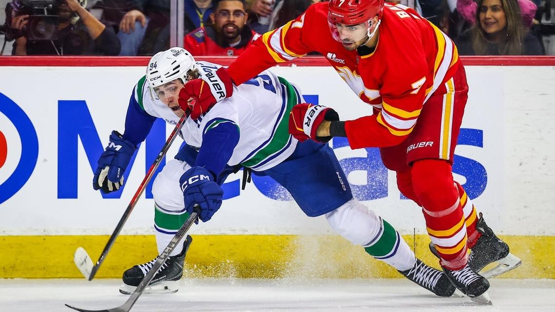 Flames remain hot, beat up on Canucks 