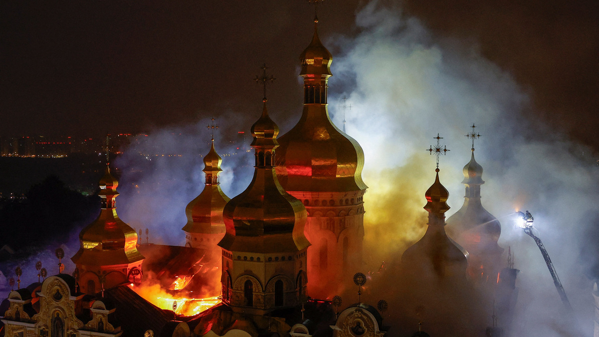 Firefighters work to extinguish a fire at the Dormition Cathedral of the Kyiv Pechersk Lavra, which was hit during Russian missile and drone strikes, amid Russia's attack on Ukraine, in Kyiv, Ukraine June 15, 2026. REUTERS/Valentyn Ogirenko