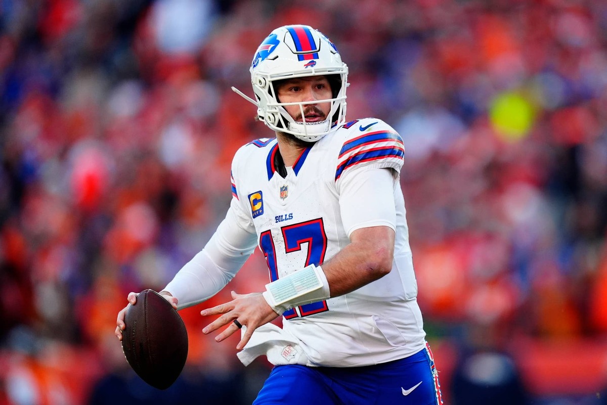  Jan 17, 2026; Denver, CO, USA; Buffalo Bills quarterback Josh Allen (17) rolls out during the second quarter of an AFC Divisional Round playoff game against the Denver Broncos at Empower Field at Mile High. Mandatory Credit: Ron Chenoy-Imagn Images 
