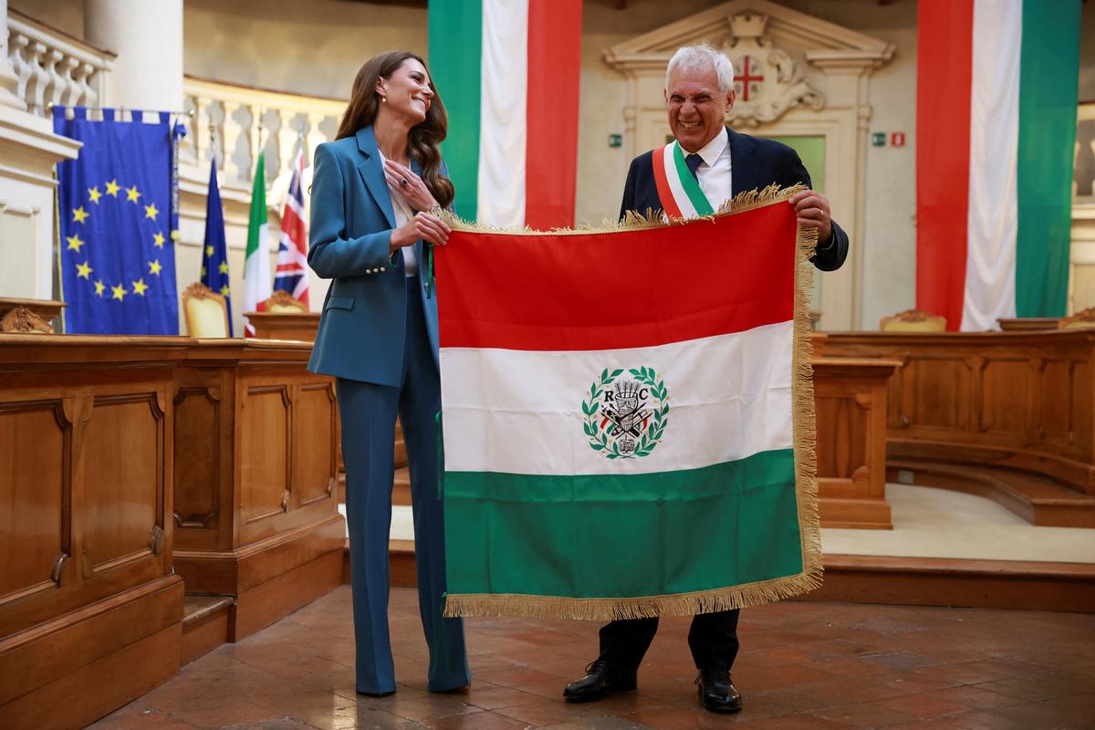 Britain's Catherine, Princess of Wales, is presented the Primo Tricolore award by Reggio Emilia Mayor Marco Massari at the city's town hall, during her two-day visit to the region, in Reggio Emilia, Italy, May 13, 2026. REUTERS/Phil Noble/Pool