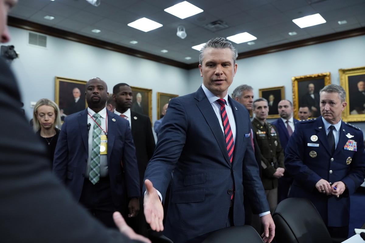 Defense Secretary Pete Hegseth, center, and Gen. Dan Caine, the chairman of the Joint Chiefs of Staff, right, arrive to testify before the House and Senate appropriations subcommittees on defense in Washington on Tuesday, May 12, 2026. (Haiyun Jiang/The New York Times)