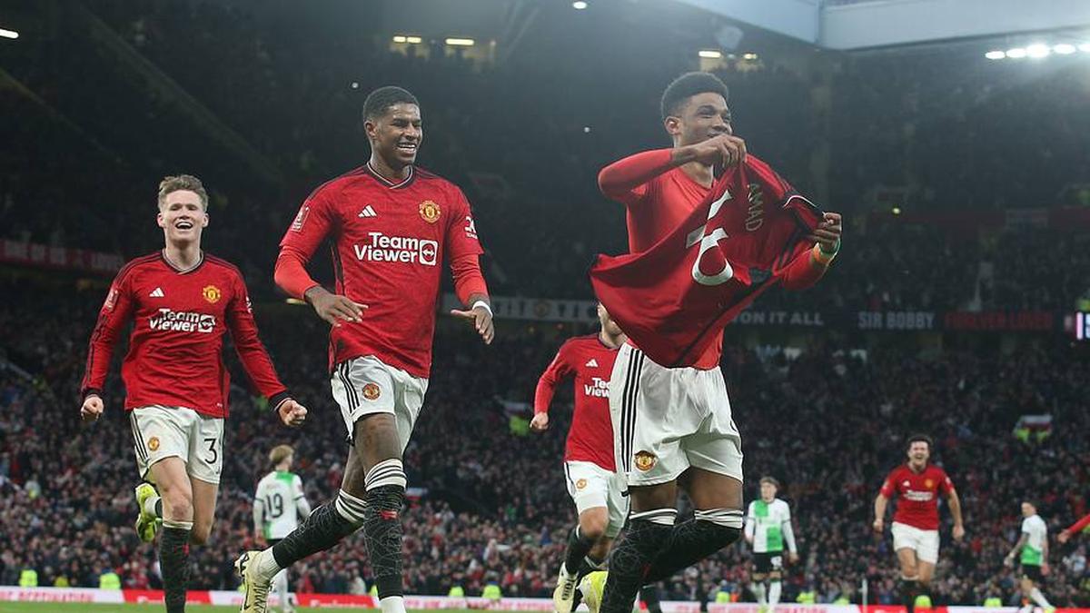  Amad Diallo (right) would soon regret his celebration. | Matthew Peters/Manchester United/Getty Images 