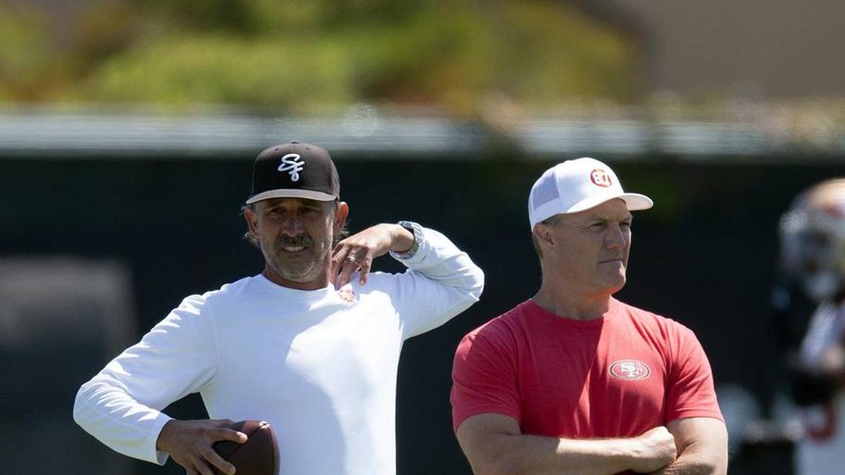  Jun 10, 2025; Santa Clara, CA, USA; San Francisco 49ers head coach Kyle Shanahan (left) and general manager John Lynch watch their team work out during an OTA at Levi's Stadium. Mandatory Credit: D. Ross Cameron-Imagn Images | D. Ross Cameron-Imagn Images 