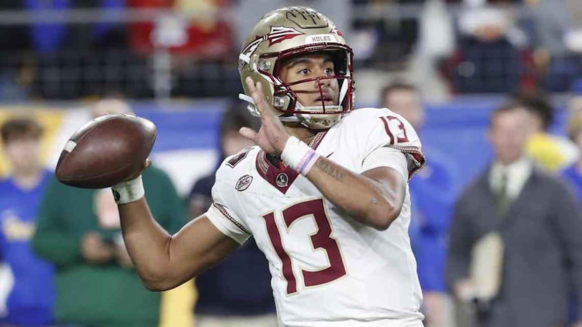  Nov 4, 2023; Pittsburgh, Pennsylvania, USA; Florida State Seminoles quarterback Jordan Travis (13) passes the ball against the Pittsburgh Panthers during the third quarter at Acrisure Stadium. The Seminoles won 24-7. Mandatory Credit: Charles LeClaire-Imagn Images | Charles LeClaire-Imagn Images 