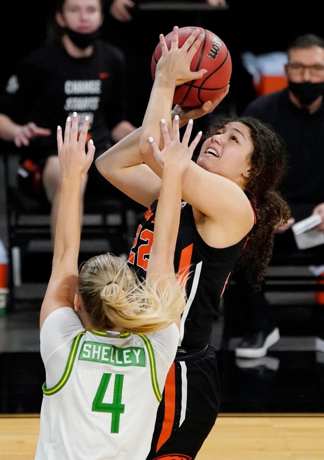 Oregon State’s Talia Von Oelhoffen (22) shoots over Oregon’s Jaz Shelley (4) during the second half of an NCAA college basketball game in the second round of the Pac-12 women’s tournament in Las Vegas.