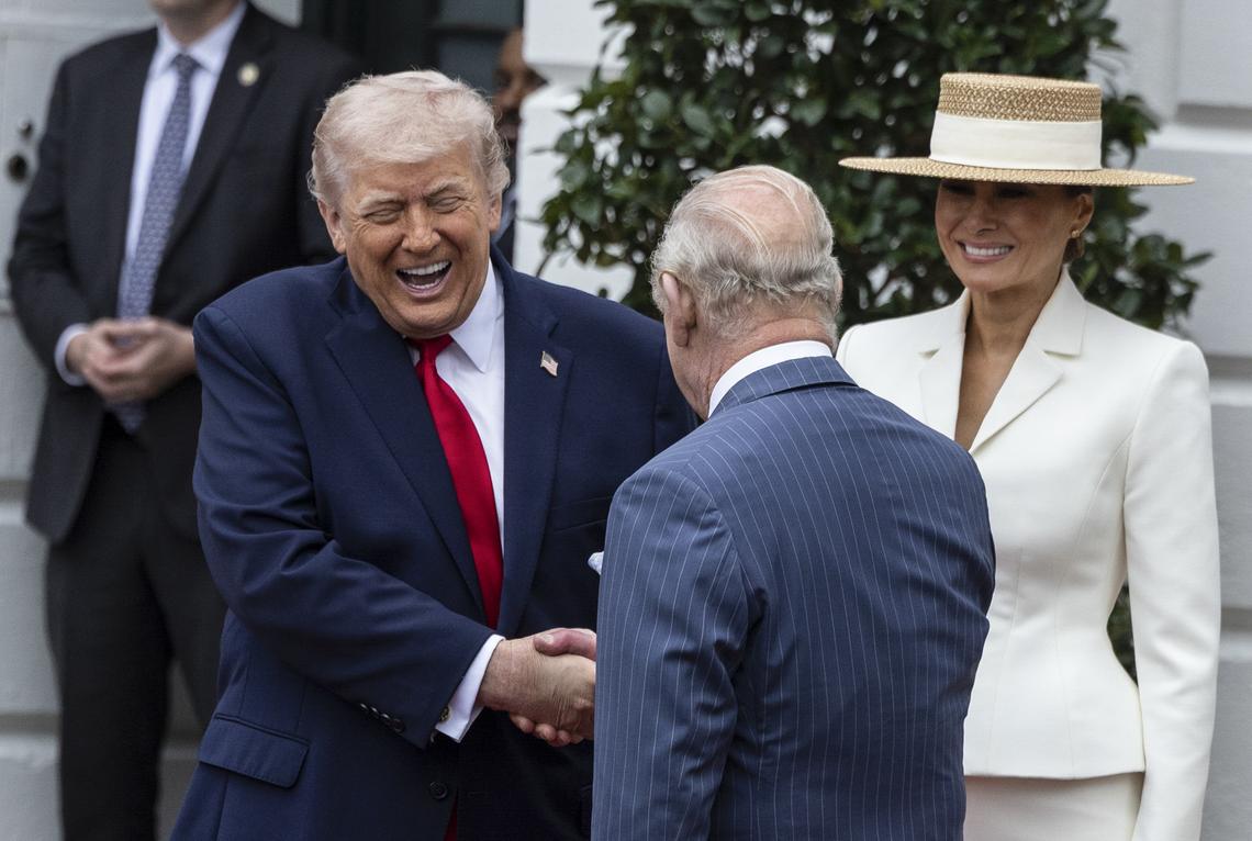 EDS. RETRANSMISSION TO PROVIDE ALTERNATE CROP *** President Donald Trump shakes hands with King Charles III as he and first lady Melania Trump greet him during an arrival ceremony on the South Lawn of the White House in Washington, on Tuesday, April 28, 2026. (Anna Rose Layden/The New York Times)