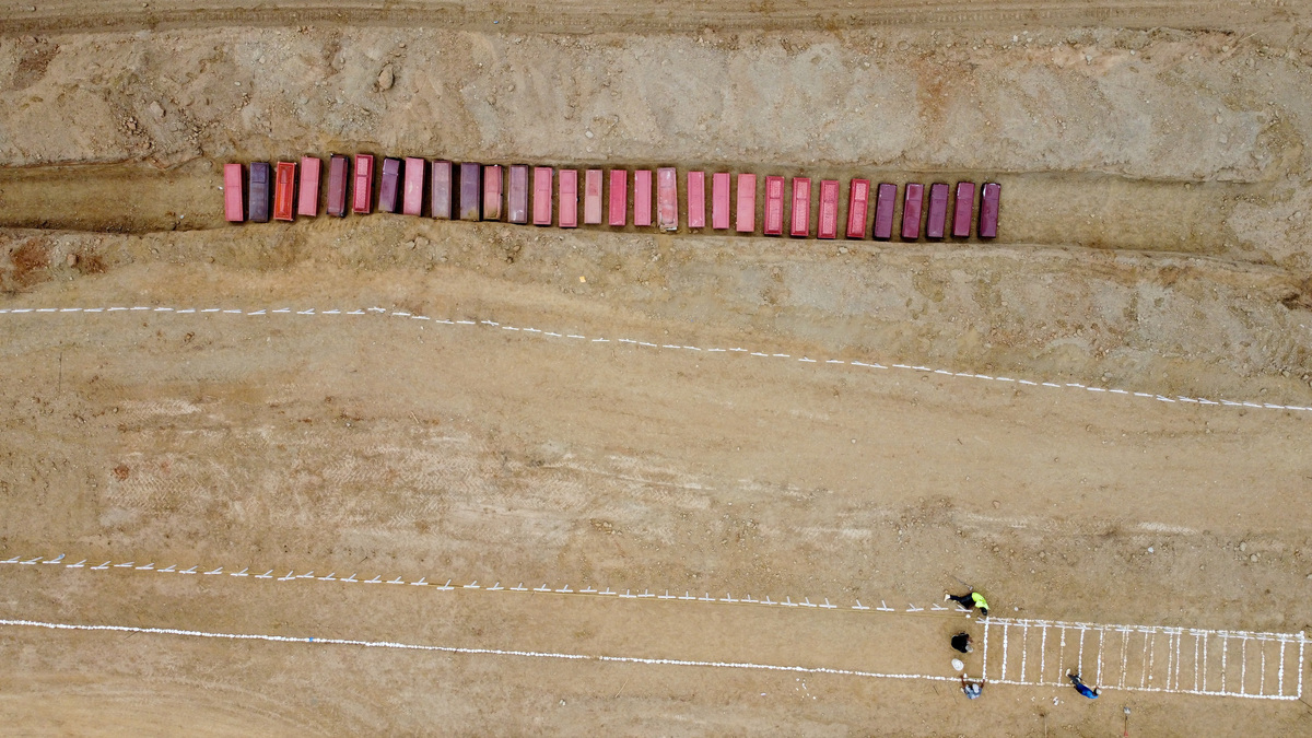 A drone view of coffins on the day of the burial of earthquake victims, in the aftermath of the June 24 earthquakes, at La Esperanza Cemetery, in La Guaira, Venezuela, July 6, 2026. REUTERS/Adriano Machado