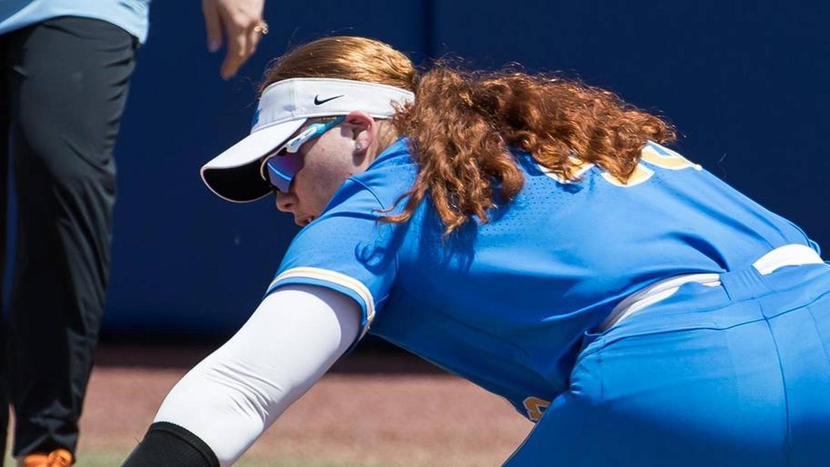  Jun 1, 2025; Oklahoma City, OK, USA; UCLA Bruins utility Megan Grant (43) touches the bag for an out in the third inning against the Tennessee Lady Volunteers during the NCAA Softball Women's College World Series at Devon Park. Mandatory Credit: Brett Rojo-Imagn Images | Brett Rojo-Imagn Images 