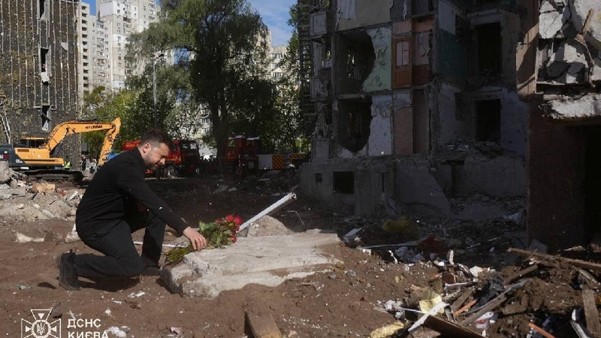 Ukraine's President Volodymyr Zelenskiy pays tribute to victims, who were killed in an apartment building damaged during yesterday's Russian missile and drone strike, amid Russia's attack on Ukraine, in Kyiv, Ukraine in this handout picture released May 15, 2026. Press service of the State Emergency Service of Ukraine in Kyiv/Handout via REUTERS