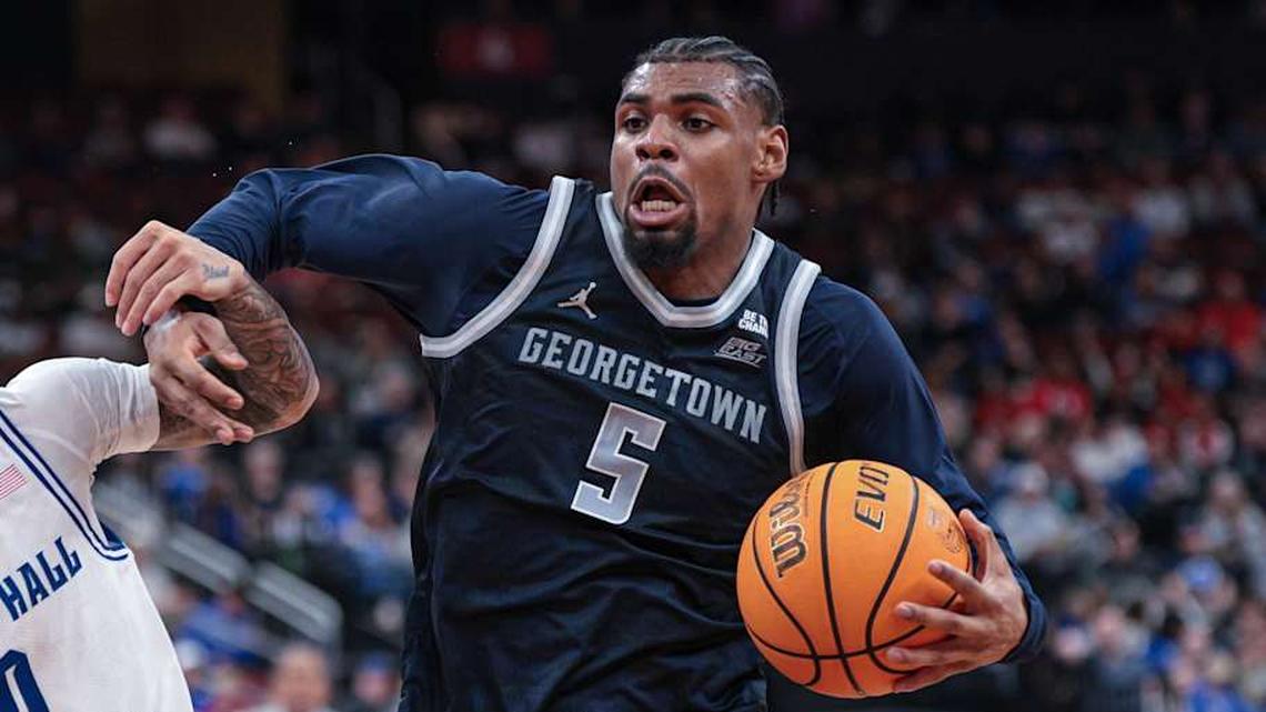  Feb 21, 2026; Newark, New Jersey, USA; Georgetown Hoyas guard KJ Lewis (5) drives to the basket against Seton Hall Pirates guard Adam Clark (0) during the first half at Prudential Center. Mandatory Credit: Vincent Carchietta-Imagn Images | Vincent Carchietta-Imagn Images 