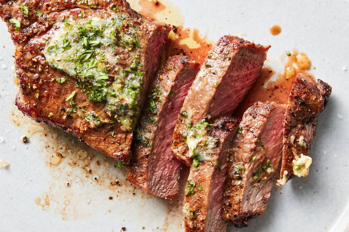 Air-fryer steak with garlic-herb butter. A steak dinner is worthy of occasion. Make it well with Ali Slagle's tips. Food Stylist: Simon Andrews. (Christopher Testani/The New York Times)