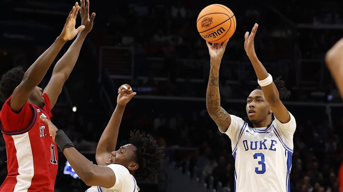  Mar 27, 2026; Washington, DC, USA; IDuke Blue Devils guard Isaiah Evans (3) shoots the ball against the St. John's Red Storm in the second half during a Sweet Sixteen game of the East Regional of the men's 2026 NCAA Tournament at Capital One Arena. Mandatory Credit: Geoff Burke-Imagn Images | Geoff Burke-Imagn Images 