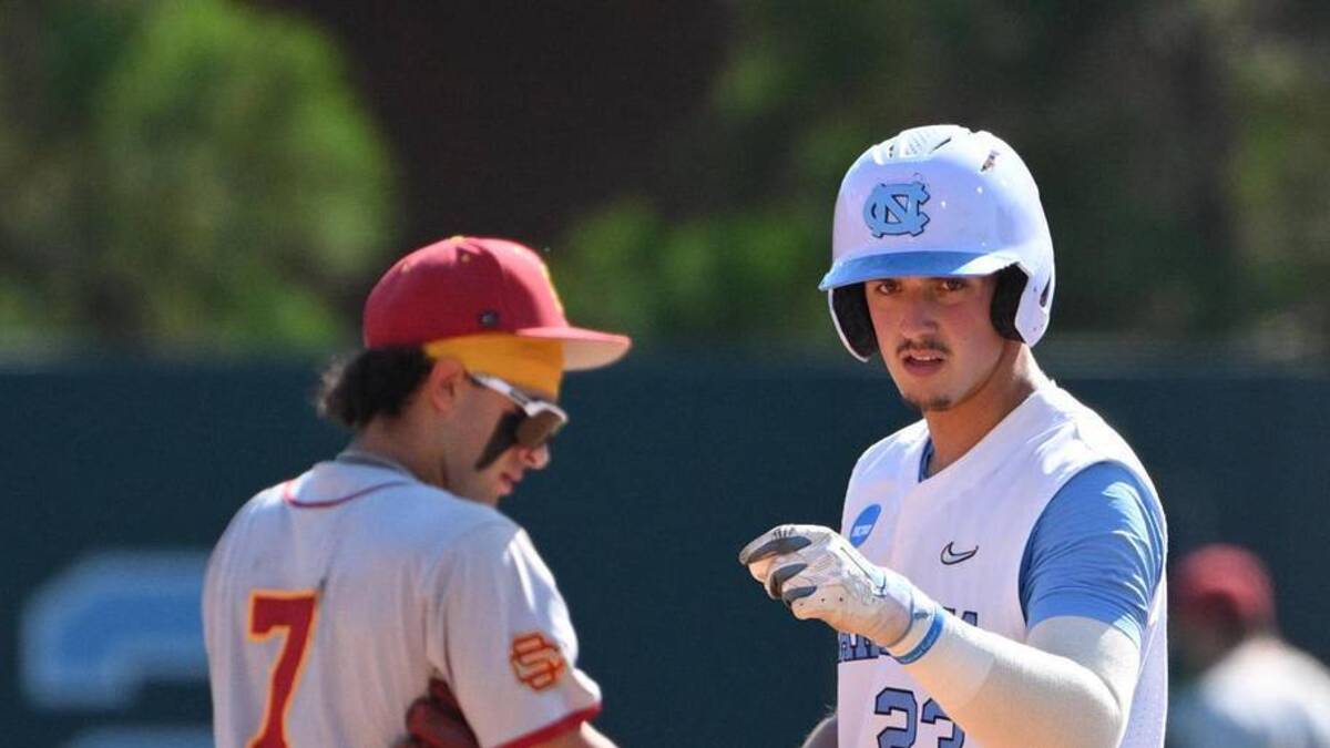  Jun 5, 2026; Chapel Hill, NC, USA; North Carolina Tar Heels catcher Colin Hynek (23) reacts after making it to second base against the USC Trojans in the fourth inning at Boshamer Stadium. Mandatory Credit: Zachary Taft-Imagn Images | Zachary Taft-Imagn Images 