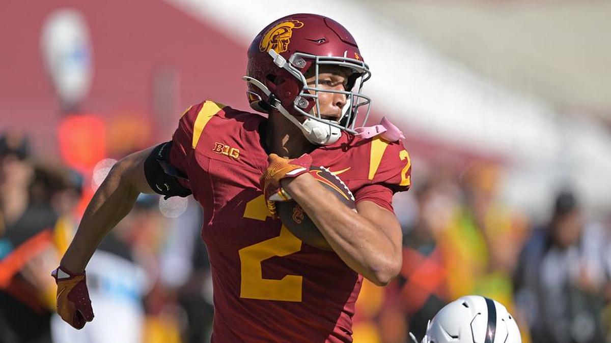  Oct 12, 2024; Los Angeles, California, USA; USC Trojans wide receiver Duce Robinson (2) runs the ball after a complete pass before he is stopped by Penn State Nittany Lions safety Zakee Wheatley (6) in the second half at United Airlines Field at the Los Angeles Memorial Coliseum. Mandatory Credit: Jayne Kamin-Oncea-Imagn Images | Jayne Kamin-Oncea-Imagn Images 