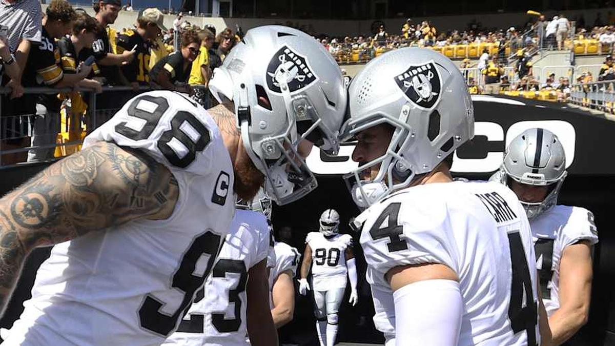  Sep 19, 2021; Pittsburgh, Pennsylvania, USA; Las Vegas Raiders defensive end Maxx Crosby (98) and quarterback Derek Carr (4) prepare to take the field to play the Pittsburgh Steelers at Heinz Field. Mandatory Credit: Charles LeClaire-Imagn Images | Charles LeClaire-Imagn Images 