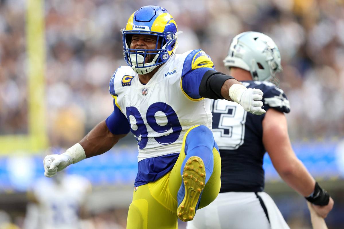  INGLEWOOD, CALIFORNIA - OCTOBER 09: Aaron Donald #99 of the Los Angeles Rams reacts after sacking Cooper Rush #10 of the Dallas Cowboys during the first half of a game at SoFi Stadium on October 09, 2022 in Inglewood, California. (Photo by Sean M. Haffey/Getty Images) 