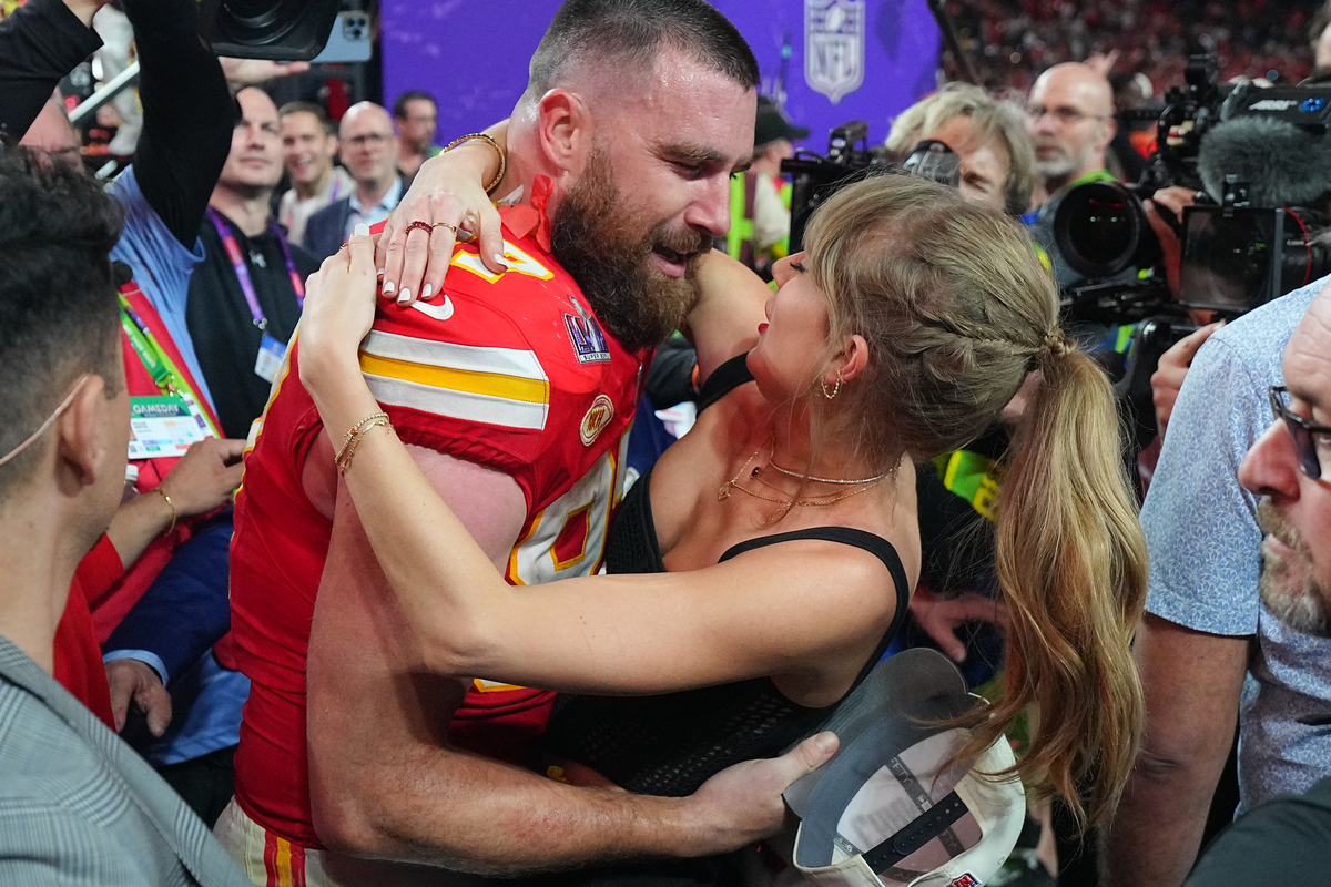 Travis Kelce kisses Taylor Swift following victory vs San Francisco 49ers at Allegiant Stadium. Las Vegas, NV 2/11/2024Erick W. Rasco/Sports Illustrated via Getty Images