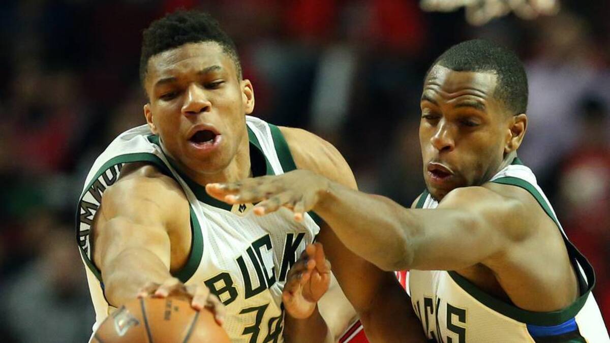  Mar 7, 2016; Chicago, IL, USA; Milwaukee Bucks forward Giannis Antetokounmpo (34), Milwaukee Bucks guard Khris Middleton (22) and Chicago Bulls guard Justin Holiday (7) go after a loose ball during the game at United Center. Mandatory Credit: Caylor Arnold-USA TODAY Sports | IMAGN IMAGES via Reuters Connect 