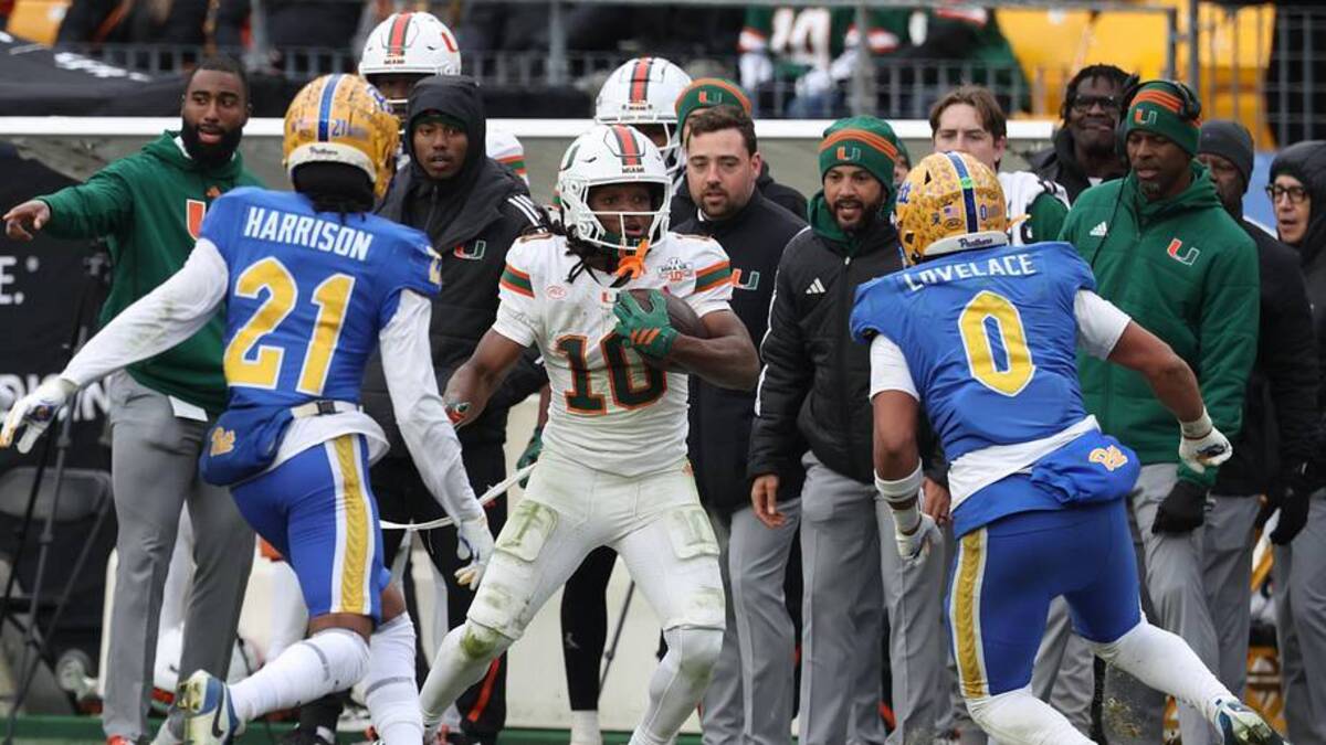  Nov 29, 2025; Pittsburgh, Pennsylvania, USA; Miami Hurricanes wide receiver Malachi Toney (10) runs after a catch as Pittsburgh Panthers defensive back Shadarian Harrison (21) and linebacker Braylan Lovelace (0) defend during the fourth quarter at Acrisure Stadium. Mandatory Credit: Charles LeClaire-Imagn Images | Charles LeClaire-Imagn Images 