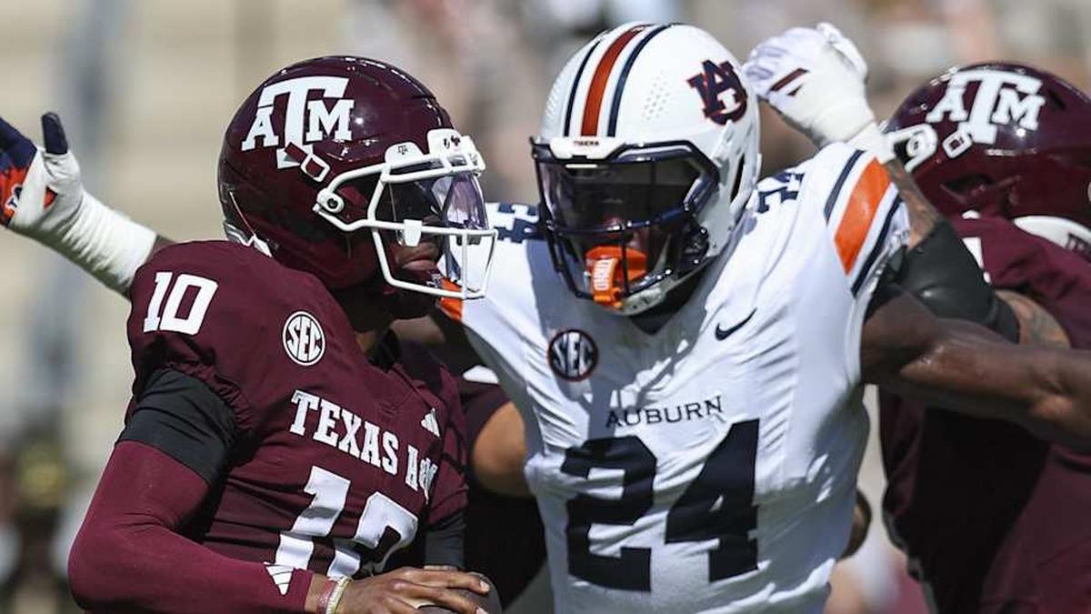  Sep 27, 2025; College Station, Texas, USA; Texas A&M Aggies quarterback Marcel Reed (10) looks for an open receiver as Auburn Tigers defensive end Keyron Crawford (24) applies defensive pressure during the second quarter at Kyle Field. Mandatory Credit: Troy Taormina-Imagn Images | Troy Taormina-Imagn Images 