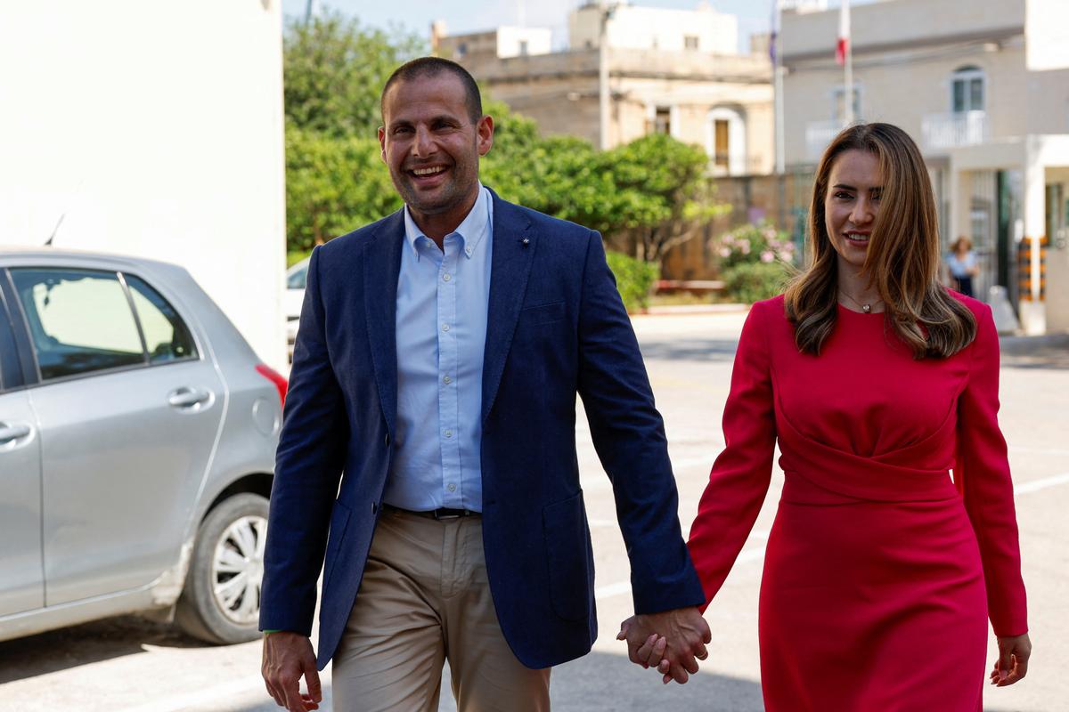 Malta's Prime Minister and Labour Party leader Robert Abela arrives with his wife Lydia to vote during Malta's general election at a polling station in Zejtun, Malta, May 30, 2026.  REUTERS/Darrin Zammit Lupi