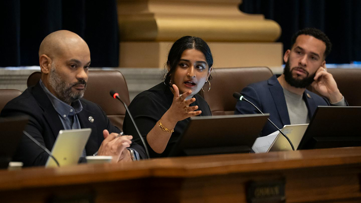 Councilmember Aisha Chughtai defends a city study into adult bath houses as pro-LGTBQ during a City Council meeting at City Hall in Minneapolis on April 9, 2026. Council President Elliott Payne, left, and council member Jamison Whiting, right, sit beside her. (Renee Jones Schneider/The Minnesota Star Tribune/TNS)