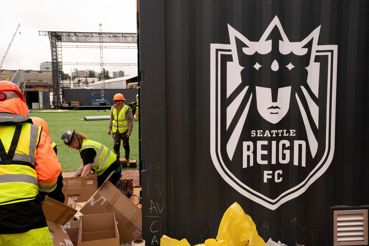 Workers construct a floating pitch and event space on a barge, dubbed the Seattle Soccer Celebration, which will be home to watch parties and events organized and hosted by Seattle Sounders FC, Seattle Reign FC, and RAVE Foundation while located on the Seattle waterfront during the FIFA World Cup 2026, in Everett, Washington, U.S., June 4, 2026. REUTERS/David Ryder