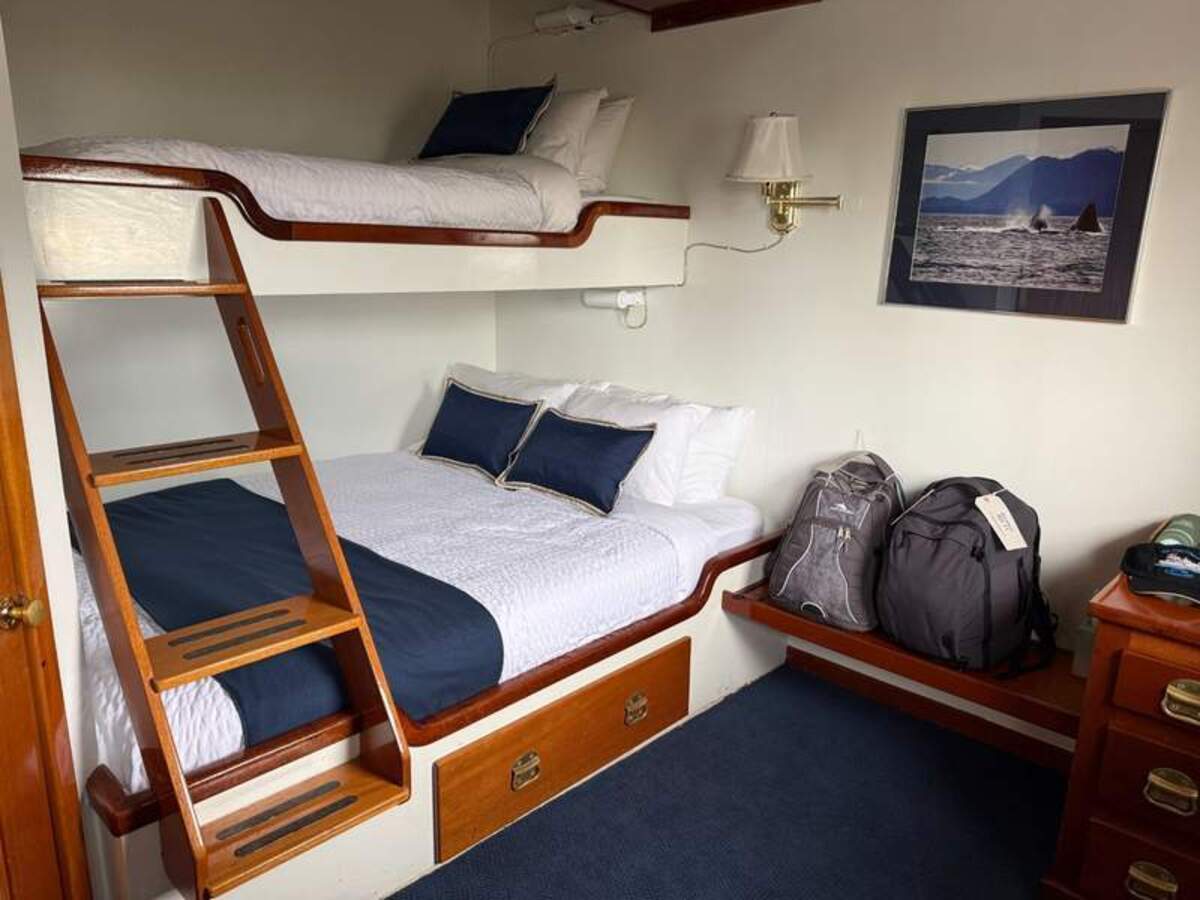  Most cabins, like this one, have bunk beds (lower queen and upper twin) and lots of storage. Photo credit: Mimi Slawoff 