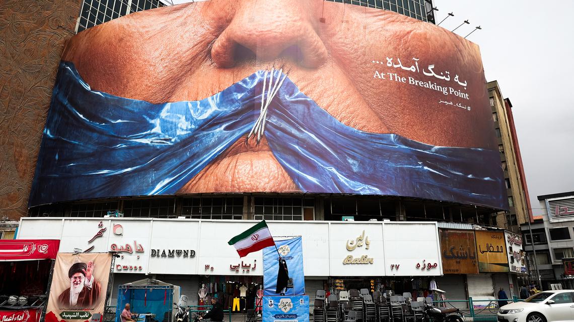 Trump says US to pause guiding ships through Strait of Hormuz while seeking Iran deal 