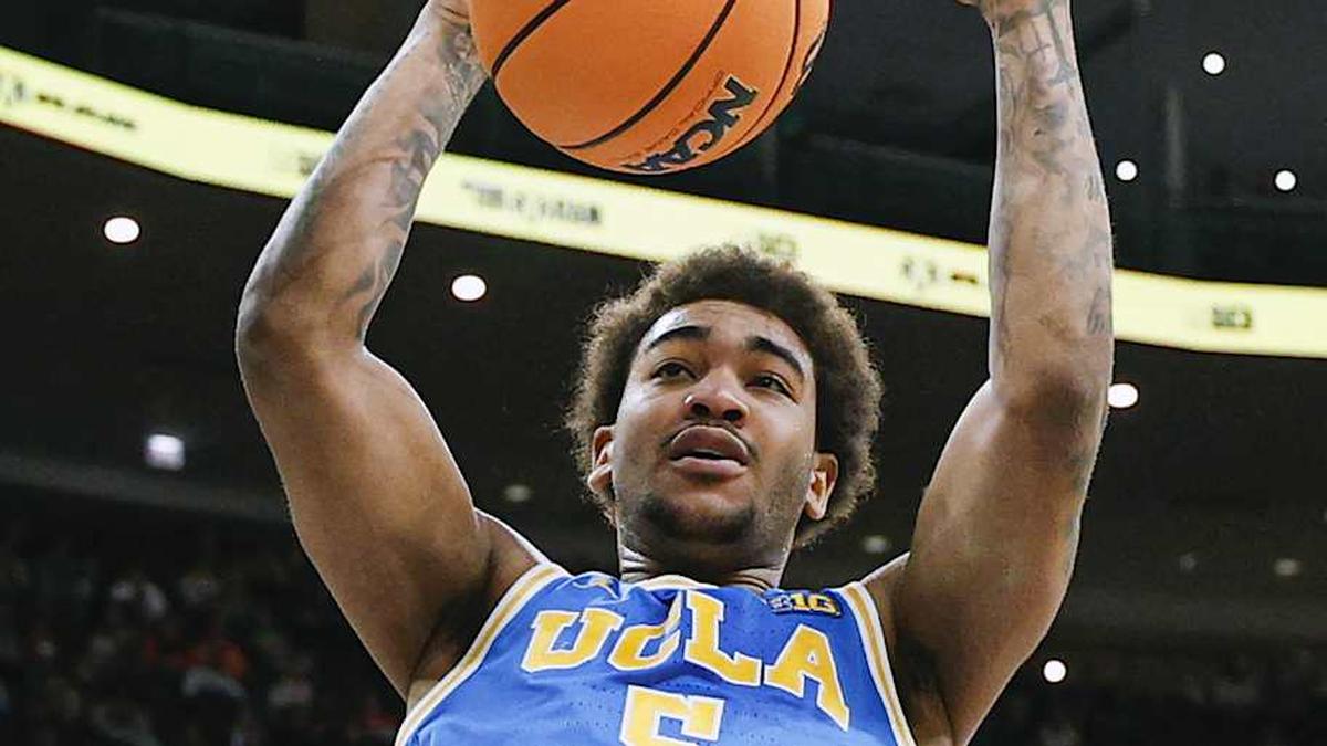  Mar 13, 2026; Chicago, IL, USA; UCLA Bruins guard Brandon Williams (5) scores against the Michigan State Spartans during the first half at United Center. Mandatory Credit: Kamil Krzaczynski-Imagn Images | Kamil Krzaczynski-Imagn Images 
