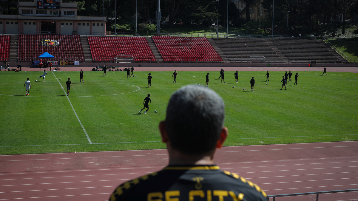 A fan watches a game between FC Davis and San Francisco City FC at the Kezar Stadium in San Francisco, California, U.S., May 17, 2026. REUTERS/Carlos Barria