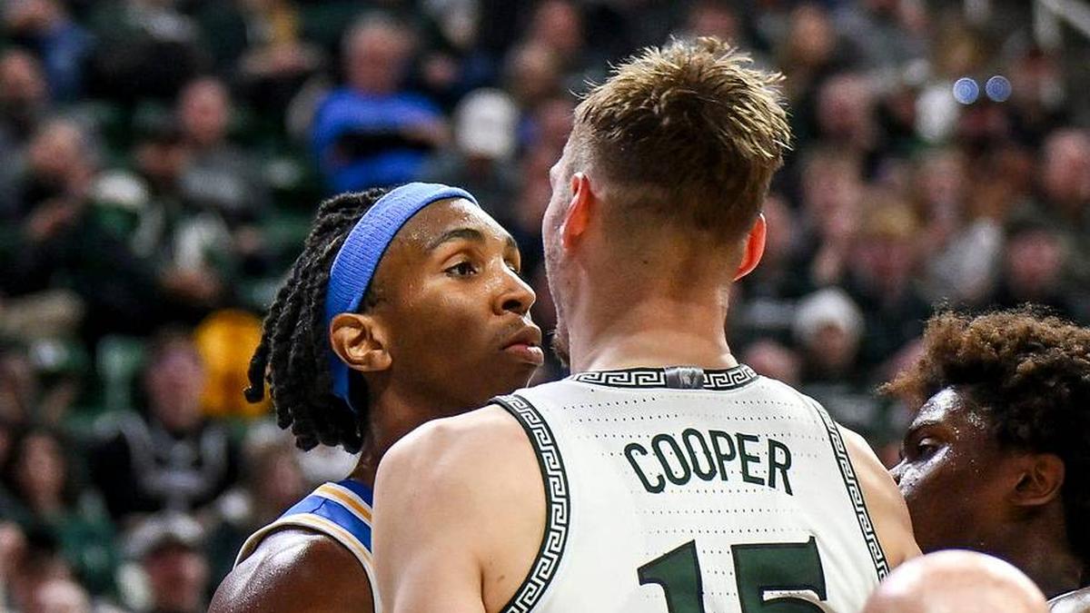  Michigan State's Carson Cooper, right, and UCLA's Steven Jamerson, left, stare each other down after Jamerson's flagrant foul on Cooper during the second half on Tuesday, Feb. 17, 2026, at the Breslin Center in East Lansing. | Nick King/Lansing State Journal / USA TODAY NETWORK via Imagn Images 