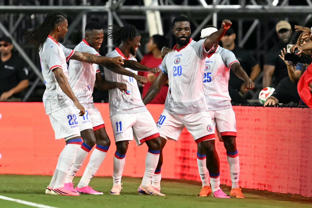  Frantzdy Pierrot celebrates with teammates during an international friendly football match between Haiti and New Zealand. Photo by CHANDAN KHANNA / AFP via Getty Images