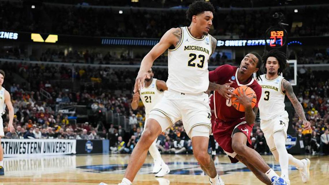  Mar 27, 2026; Chicago, IL, USA; Alabama Crimson Tide guard Labaron Philon Jr. (0) drives the ball against Michigan Wolverines forward Yaxel Lendeborg (23) in the second half during a Sweet Sixteen game of the Midwest Regional of the men's 2026 NCAA Tournament at United Center. Mandatory Credit: David Banks-Imagn Images | David Banks-Imagn Images 