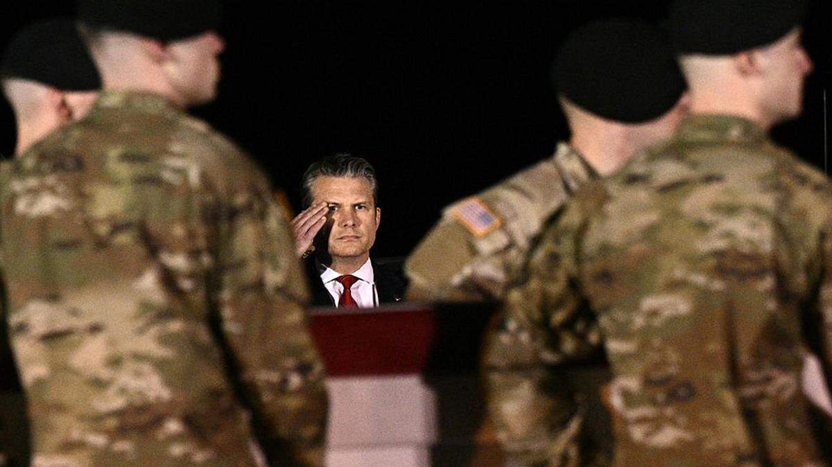 Defense secretary Pete Hegseth salutes as members of a U.S. Army team carry a flag-draped transfer case containing the remains of Sgt. Benjamin N. Pennington, 26, of Glendale, Kentucky, during a transfer event at Dover Air Force Base in Delaware on Monday. 
