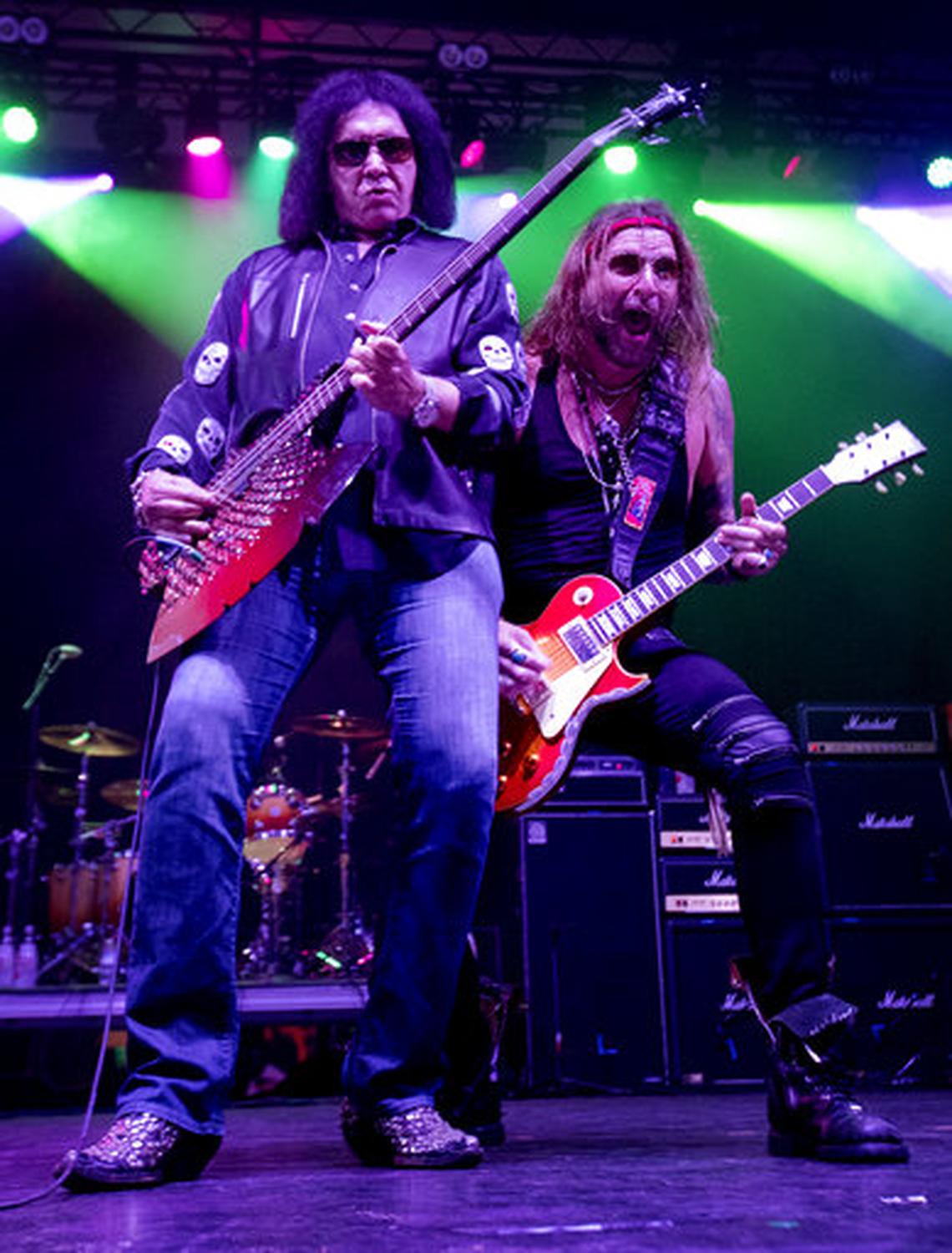 Gene Simmons, left, performs at The Children Matter: Houston Benefit Concert at CHS Field Wednesday, Sept. 20, 2017 in in St. Paul, Minn. Original Kiss members Gene Simmons and Ace Frehley reunited for their first public appearance since their group was inducted into the Rock and Roll Hall of Fame in 2014.